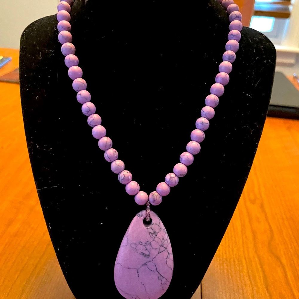 Handcrafted beaded stone necklace.